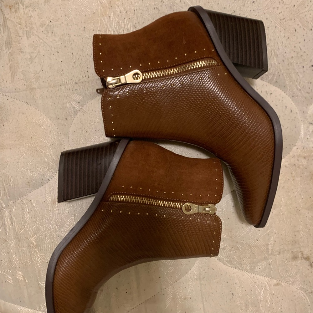 Barely worn Shoe Dazzle wedged boots. Shiny leather and still in great condition